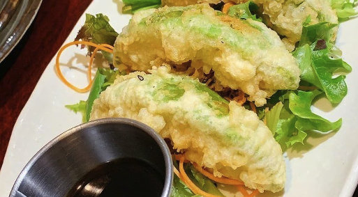 Avocado Tempura - Crispy tempura-battered avocado with spicy mayo and eel sauce